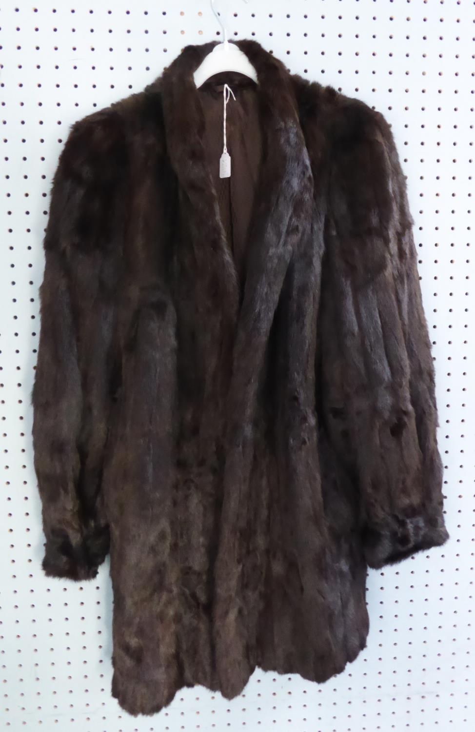 LADY'S DARK BROWN DYED ERMINE FUR COAT, three quarter length, with narrow shawl collar, triple
