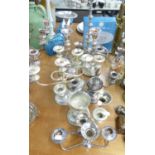 PAIR OF PLATED CANDLESTICKS, A PAIR OF PLATED CANDELABRUM, A GRADUATED SET OF PLATED CANDLESTICKS
