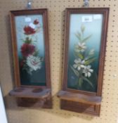 A PAIR OF VICTORIAN CARVED WOOD WALL SHELVES, TALL AND NARROW, THE MIRROR BACKS PAINTED WITH FLOWERS