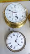 A BRASS SHIP’S TYPE WALL CLOCK, WITH 8 DAYS SPRING DRIVEN MOVEMENT AND A BRAS DRUM CASED MANTEL OR