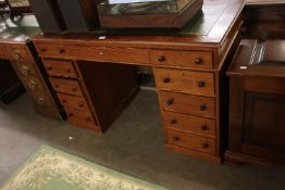 A PITCH PINE ENGLISH DOUBLE PEDESTAL DESK, WITH GREEN LEATHER SKIVER, 4’ X 1’11”