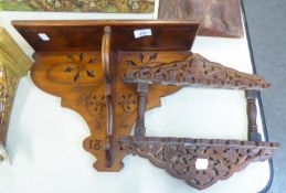 A VINE CARVED AND PIERCED TWO TIER MURAL SPOON RACK AND A PLAIN SMALL WALL RACK (2)