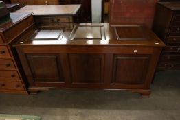 A MAHOGANY BLANKET CHEST WITH FRAMED THREE PANEL LID AND FRONT, 4’4” WIDE