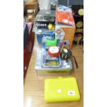 LAZER SPIRIT LEVEL AND A TIN CONTAINING SOME HAND TOOLS, STANLEY COMPACT SOCKET SET, (ON CARD AS