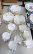 BELL CHINA TEA SERVICE, ORIGINALLY FOR TWELVE PERSONS, 10 CUPS, 11 SAUCERS, 12 SIDE PLATES, A