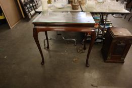 A MAHOGANY OBLONG SIDE TABLE WITH SHAPED APRON, ON FOUR CABRIOLE SUPPORTS, 2’6” WIDE AND THE LOOSE