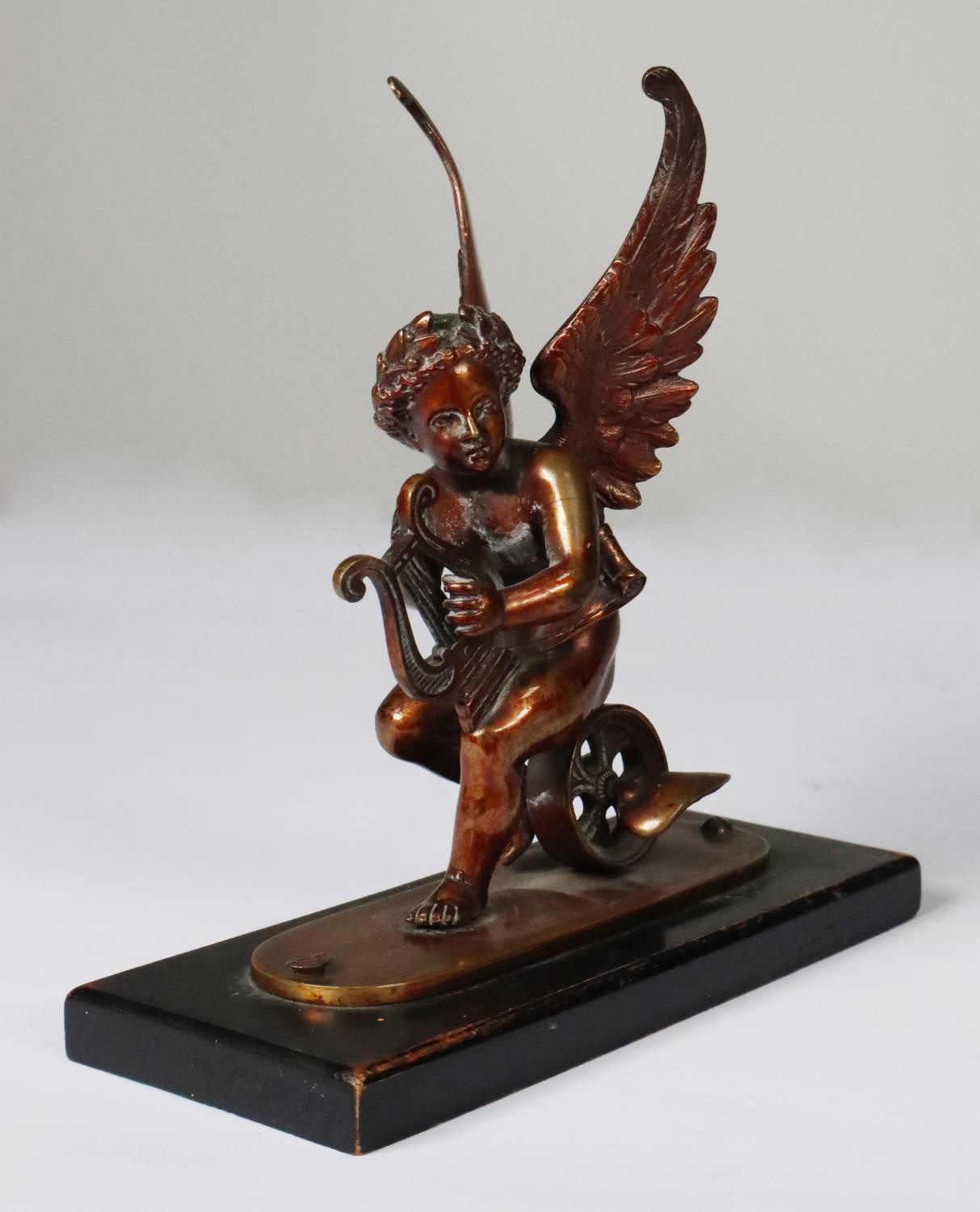 PAIR OF PATINATED BRONZE FIGURES OF WINGED PUTTO, each modelled playing a lyre and sat on a winged - Image 2 of 2