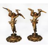 NEAR MATCHING PAIR OF RUSSIAN STYLE GILT METAL FIGURES, each modelled as a semi naked, winged female