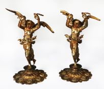 NEAR MATCHING PAIR OF RUSSIAN STYLE GILT METAL FIGURES, each modelled as a semi naked, winged female