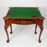 GEORGE III FIGURED WALNUT CLUB CORNER FOLD OVER CARD TABLE, the shaped top enclosing a green baize