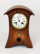 ARTS AND CRAFTS INLAID MAHOGANY MANTLE CLOCK, the 4” enamelled Roman dial powered by a drum shaped