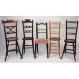 FIVE VARIOUS NINETEENTH CENTURY CORRECTION CHAIRS, comprising, four with oval, caned seats and