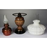 VICTORIAN MOULDED POTTERY AND BLACK GLASS OIL TABLE LAMP, with fittings, 12 ¾” (32.3cm) high,