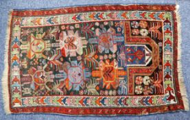 ANTIQUE DAGHESTAN PRAYER RUG, with two rows of three large formal flowers, on a midnight blue field,