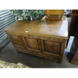 LATE EIGHTEENTH CENTURY OAK MULE CHEST, of typical form with planked top, triple panelled front