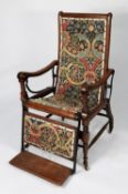 J FOOT & SON LTD, EARLY TWENTIETH CENTURY OAK RECLINING CHAIR, with folding foot rest and black