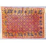 SEMI ANTIQUE SHIRAZ PERSIAN RUG, with all-over Caucasian style diamond in dark blue on a wine red