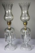 PAIR OF CLEAR GLASS ELECTRIC TABLE LAMPS MODELLED AS TABLE LUSTRES WITH STORM SHADES, each with