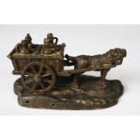 PATINATED SPELTER GROUP OF A DOG PULLING A CART CONTAINING FOUR MILK CHURNS, 3 ¼” (8.2cm) high,
