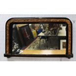 LATE VICTORIAN EBONISED AND MOULDED GILT GESSO OVERMANTLE MIRROR, the oblong plate with rounded