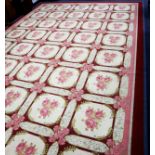 VERY LARGE MODERN MACHINE MADE CARPET with a repeat pattery of forty off-white squares, decorated