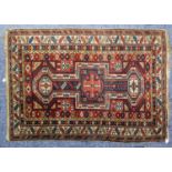 ANTIQUE SHIRVAN CAUCASIAN RUG, with geometric triple pole medallion, in red and blue with a white
