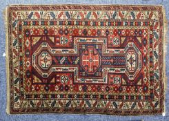 ANTIQUE SHIRVAN CAUCASIAN RUG, with geometric triple pole medallion, in red and blue with a white