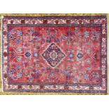 EASTERN CARPET, with small centre medallion and all-over floral and foliate scroll design on a