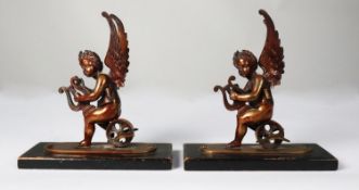 PAIR OF PATINATED BRONZE FIGURES OF WINGED PUTTO, each modelled playing a lyre and sat on a winged