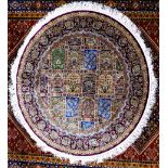 KIRMAN, PERSIAN, PART SILK CIRCULAR RUG, the centre section filled with a tile pattern, each tile