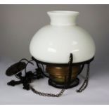 EARLY TWENTIETH CENTURY BRASS AND BLACK METAL RISE AND FALL CEILING OIL LIGHT, converted to
