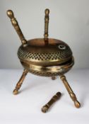PAIR OF INDIAN ENGRAVED AND PIERCED BRASS FOOT WARMING STOOLS, each of circular form with bands of