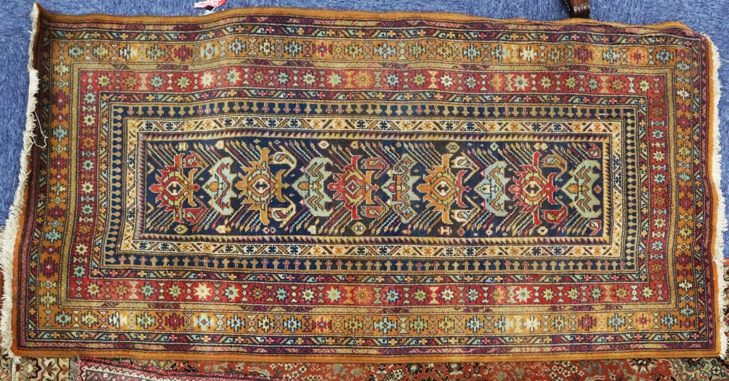 CAUASIAN TALISH LONG RUG with narrow midnight blue field, having ten pole medallions, very broad