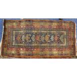 CAUASIAN TALISH LONG RUG with narrow midnight blue field, having ten pole medallions, very broad