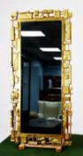 EARLY 1970's AMERICAN 'SYROCO BRUTALIST' GILT PLASTIC FRAMED WALL MIRROR, marked with Copyright date