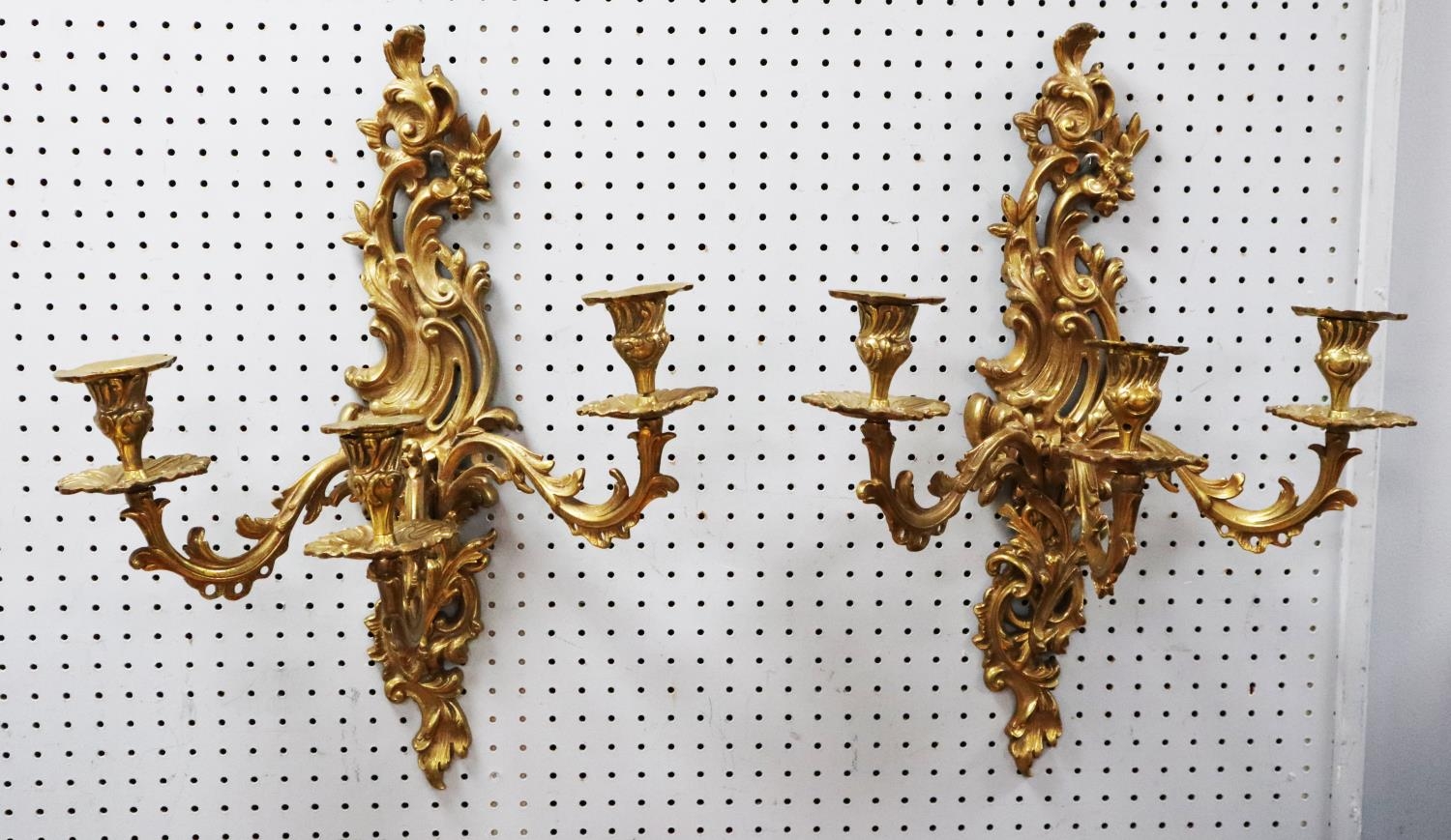 PAIR OF LOUIS VX STYLE CAST GILT METAL THREE BRANCH WALL LIGHTS, each with foliate scroll back plate