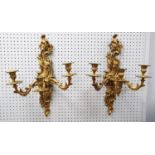 PAIR OF LOUIS VX STYLE CAST GILT METAL THREE BRANCH WALL LIGHTS, each with foliate scroll back plate