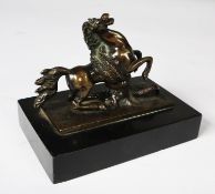 PATINATED BRONZE GROUP OF A REARING HORSE BEING ATTACKED BY A LARGE SNAKE, on an oblong base, and