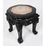 CHINESE CARVED AND EBONISED WOOD AND RED VEINED MARBLE URN STAND, the shaped circular top with