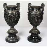 PAIR OF LATE 19th CENTURY CAST METAL CLASSICAL STYLE TWO HANDLE PEDESTAL VASES of shouldered ovoid