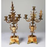 PAIR OF LATE NINETEENTH CENTURY GILT METAL AND ONYX FIVE LIGHT CANDELABRA, original part of a