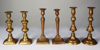 THREE PAIRS OF BRASS EJECTOR CANDLESTICKS, 11” (28cm) high and smaller, (6)