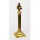 EARLY TWENTIETH CENTURY BRASS COLUMN TABLE LAMP, of fluted form with stepped square base, 19 ½” (
