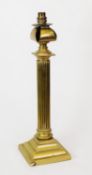 EARLY TWENTIETH CENTURY BRASS COLUMN TABLE LAMP, of fluted form with stepped square base, 19 ½” (