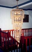 IMPRESSIVE, MODERN GILT METAL AND GLASS TWENTY TWO LIGHT CEILING LIGHT, comprising, six graduating