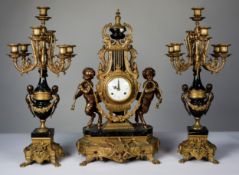 LOUIS XV STYLE ‘IMPERIAL’ BRASS AND BLACK VEINED MARBLE THREE PIECE CLOCK GARNITURE, the CLOCK