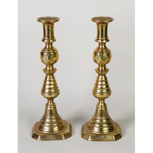 THREE PAIRS OF BRASS EJECTOR CANDLESTICKS, 11 ¾”- 4 ¾” (29.9cm–12cm) high, (6)