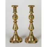 THREE PAIRS OF BRASS EJECTOR CANDLESTICKS, 11 ¾”- 4 ¾” (29.9cm–12cm) high, (6)