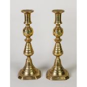 THREE PAIRS OF BRASS EJECTOR CANDLESTICKS, 11 ¾”- 4 ¾” (29.9cm–12cm) high, (6)