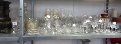 A HEAVY CUT GLASS CONICAL DECANTER AND STOPPER; A CUT GLASS GLOBE AND SHAFT SHAPED WINE DECANTER;